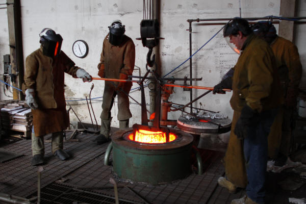 Removing Crucible of Molten Bronze from Furnace