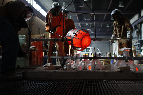 Pouring Bronze into Shell Mold