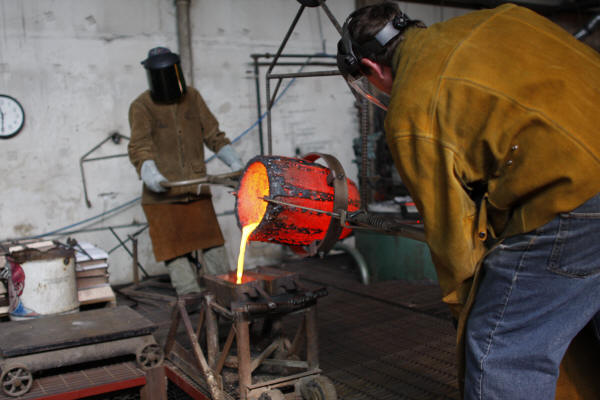 Pouring Extra Bronze into Ingot Molds