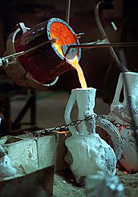 Pouring Bronze into Shell Mold