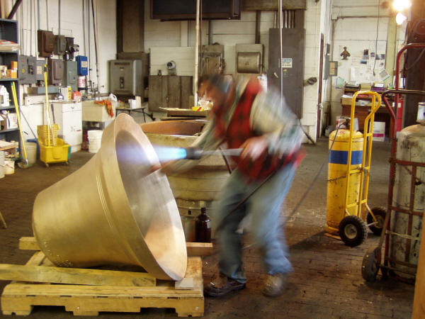 Applying New Patina During Restoration of Bronze Bell