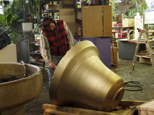Applying New Patina During Restoration of Bronze Bell