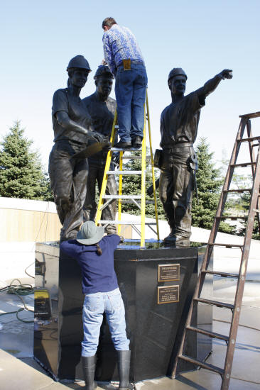 Scrubbing "Teamwork" Sculpture