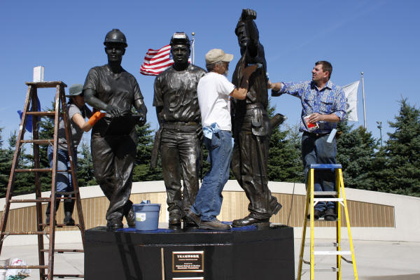 Cleaning and Waxing "Teamwork" Sculpture